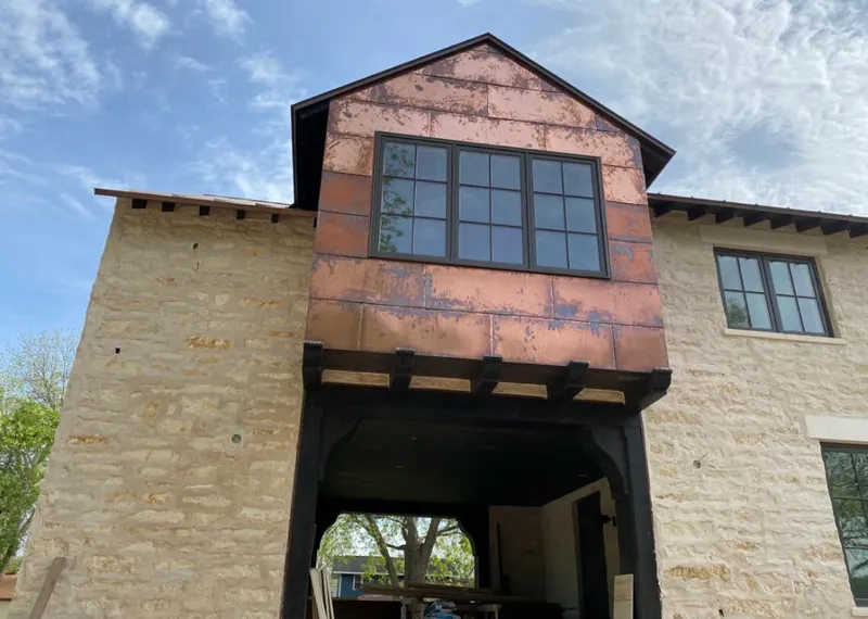 Copper metal panel facade on a stone building for Skylight Installation in Egypt Lake-Leto