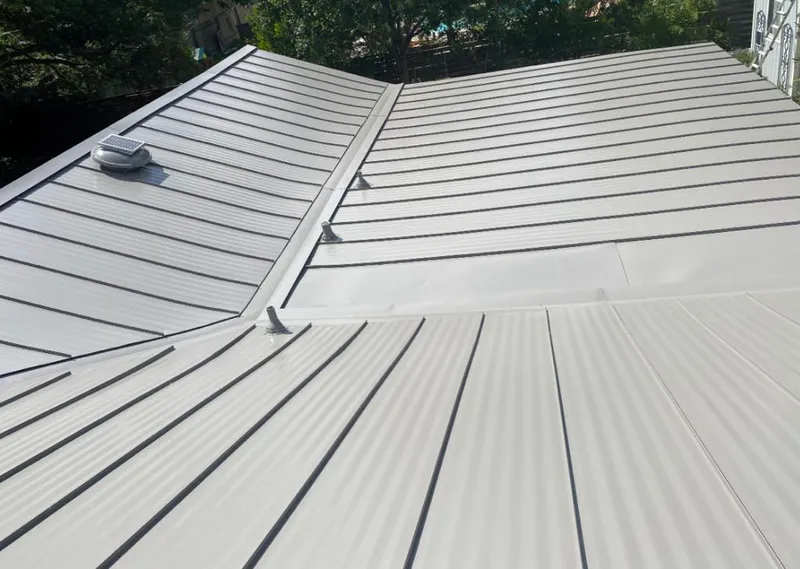 Solar attic fan installed on a metal roof for Roof Ventilation in Egypt Lake-Leto